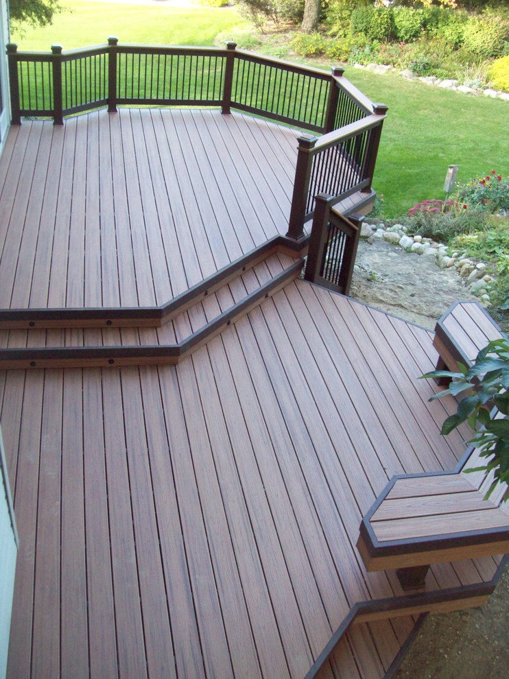 This is an example of a mid-sized contemporary backyard deck in Detroit with no cover.