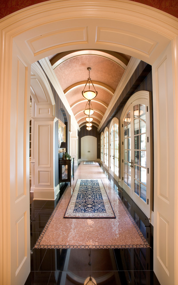 This is an example of a large traditional hallway in Cleveland with multi-coloured floor.