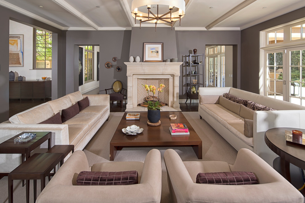 Tuscan formal living room photo in Los Angeles with gray walls and a standard fireplace
