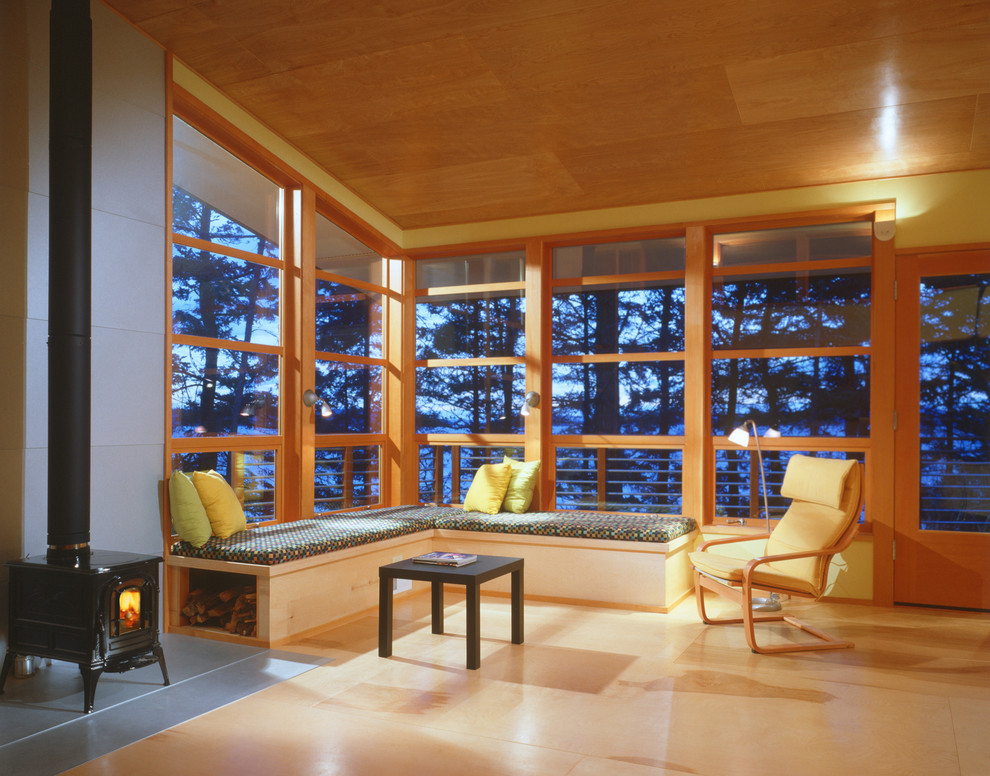 This is an example of a modern living room in Seattle with a wood stove.