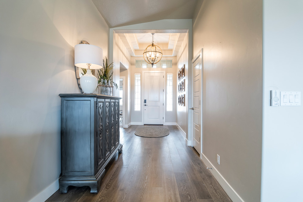 Mid-sized transitional medium tone wood floor entry hall photo in Salt Lake City with a white front door and gray walls