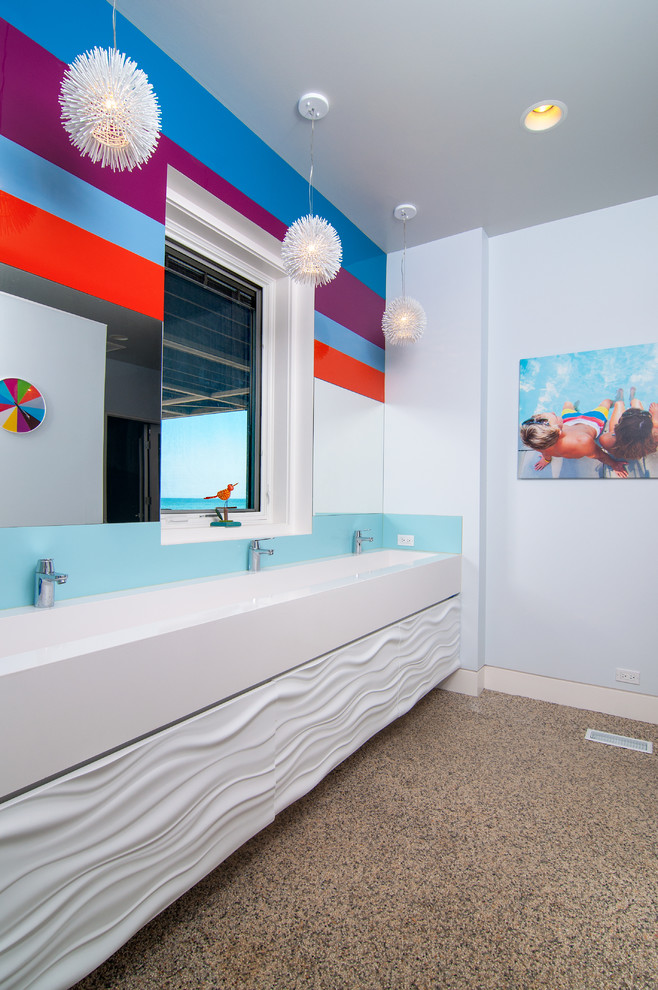 Beach style kids bathroom in Chicago with white cabinets, blue walls, concrete floors, a trough sink and brown floor.