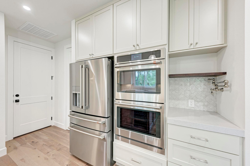 Example of a transitional kitchen design in Austin