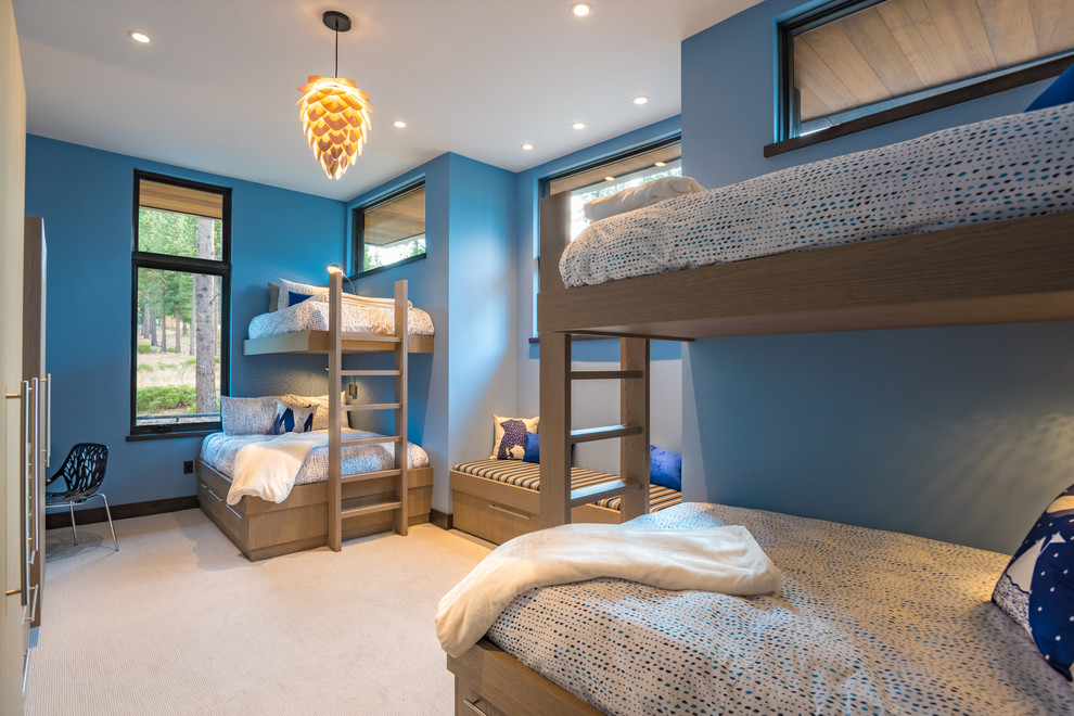 Design ideas for a contemporary gender-neutral kids' bedroom in Sacramento with blue walls, carpet and beige floor.