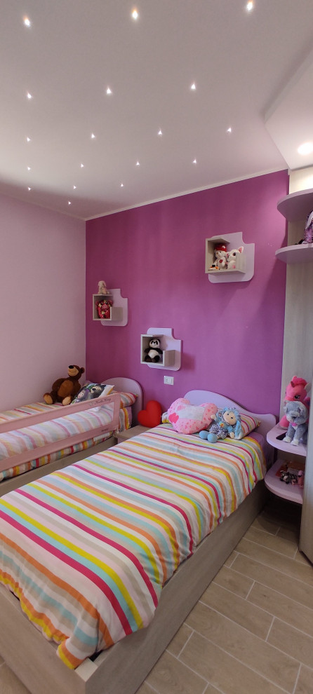 This is an example of a large modern gender-neutral kids' bedroom for kids 4-10 years old in Other with purple walls and porcelain floors.