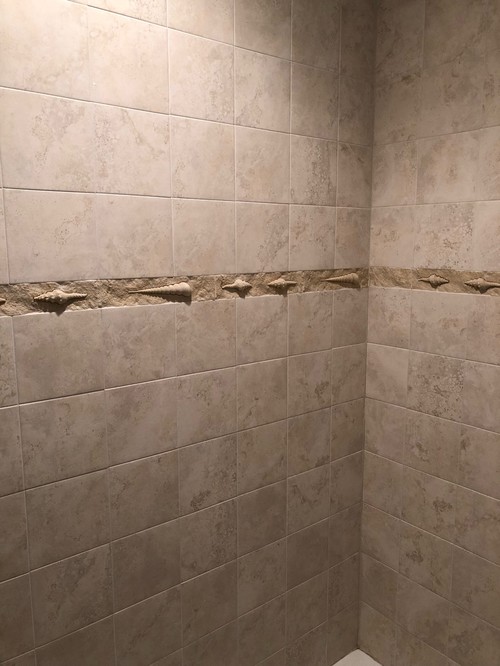 What to do with tile accent strips in shower?