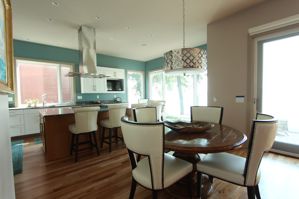 Inspiration for a mid-sized transitional light wood floor great room remodel with gray walls