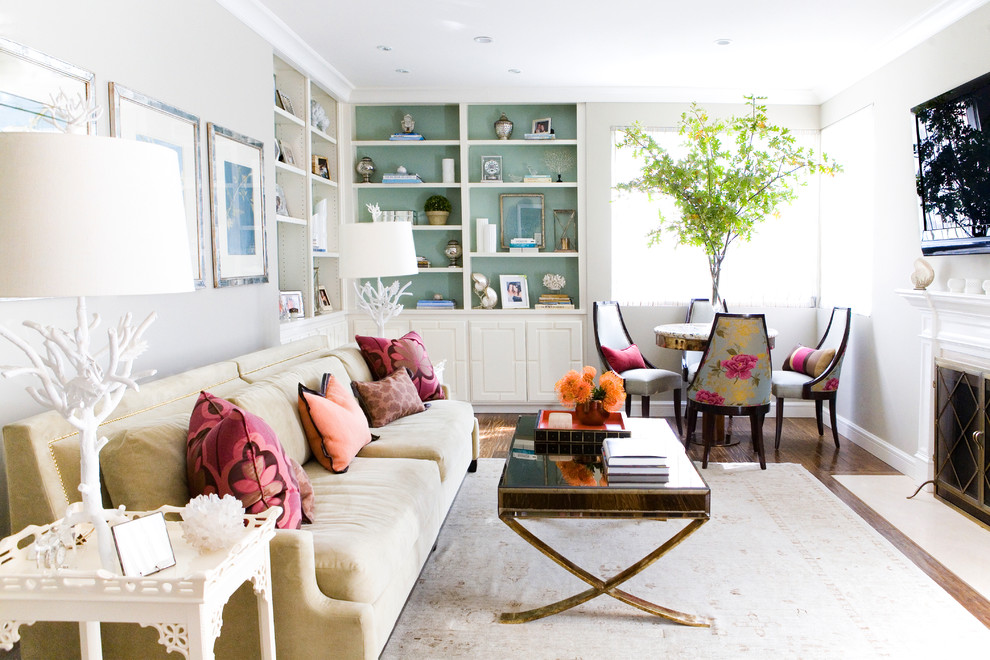 Transitional living room in Los Angeles with beige walls and a wall-mounted tv.