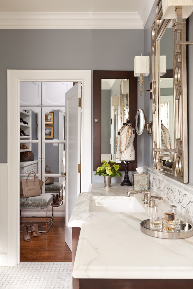 Inspiration for a mid-sized transitional master bathroom in Denver with medium wood cabinets, grey walls, medium hardwood floors, an integrated sink, brown floor and white benchtops.