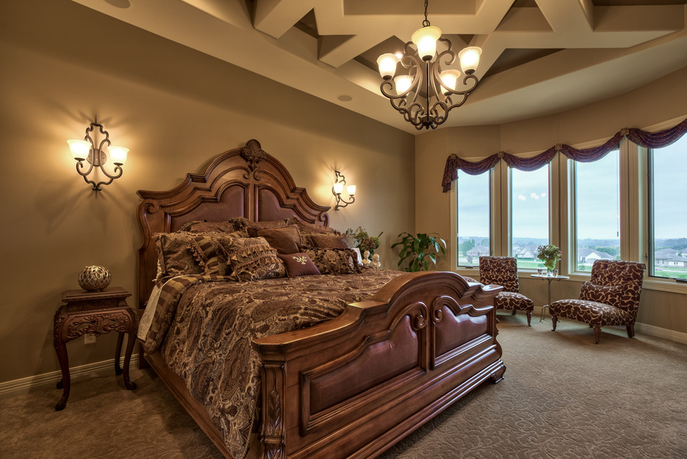 Design ideas for a large mediterranean master bedroom in Omaha with beige walls, carpet and beige floor.