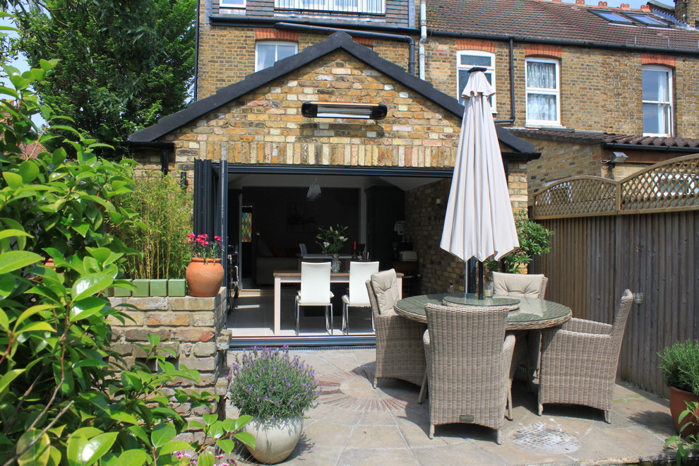 This is an example of a transitional patio in London.