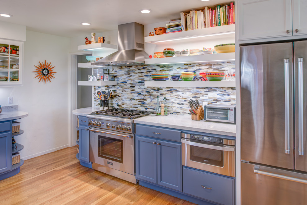 Eat-in kitchen - mid-sized traditional u-shaped light wood floor eat-in kitchen idea in San Francisco with a single-bowl sink, flat-panel cabinets, gray cabinets, quartz countertops, multicolored backsplash, glass tile backsplash, stainless steel appliances and no island