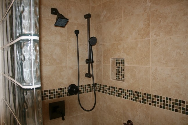 This walk in ceramic showers has been one of our most selected options.  We believe that no home should be built without one on at least the main level. Multiple shower heads, one is adjustable and gr