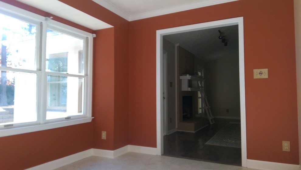 Enclosed dining room - mid-sized enclosed dining room idea with orange walls and no fireplace