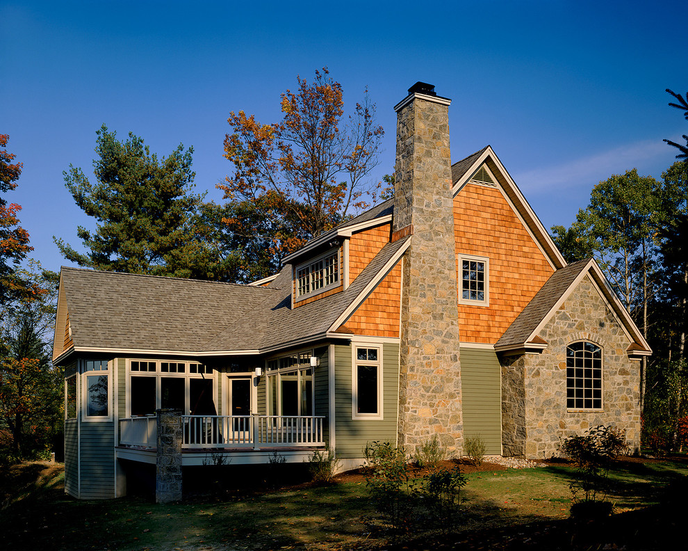This is an example of a country exterior in New York with wood siding and a gable roof.