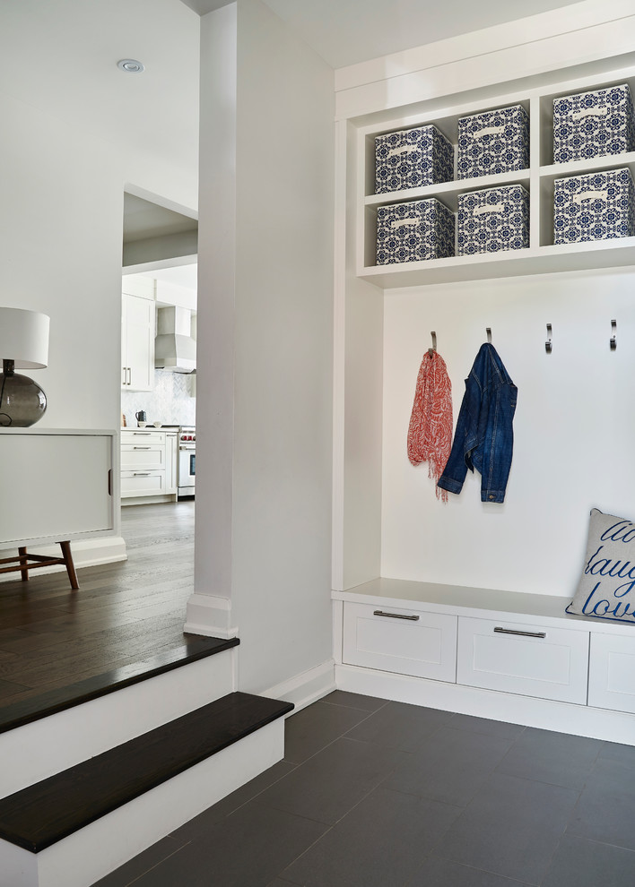 Foyer - mid-sized transitional ceramic tile foyer idea in Toronto with white walls and a white front door