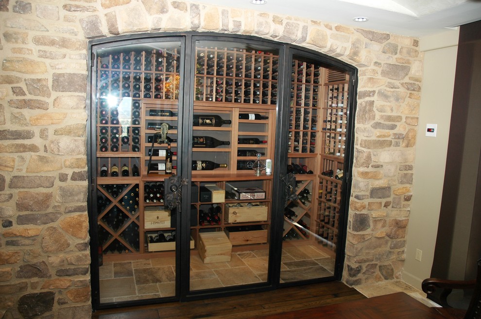 Design ideas for a small contemporary wine cellar in San Diego with terra-cotta floors and display racks.
