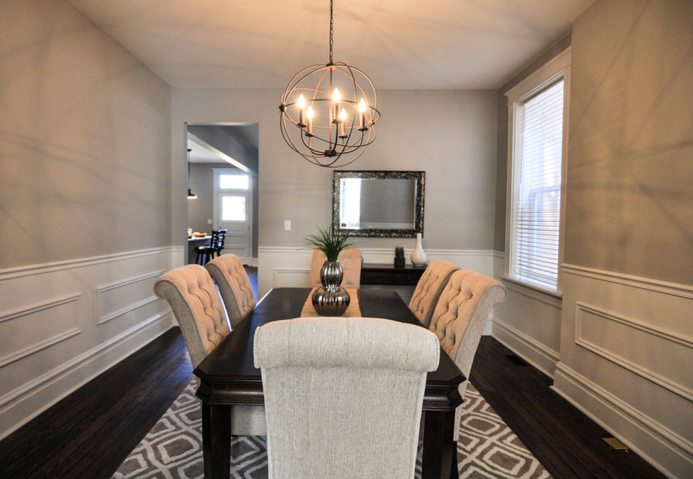 Mid-sized transitional separate dining room in St Louis with grey walls, medium hardwood floors and no fireplace.