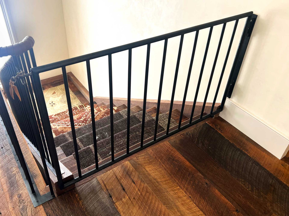 Design ideas for a rustic wood l-shaped metal railing staircase in Other with wood risers.