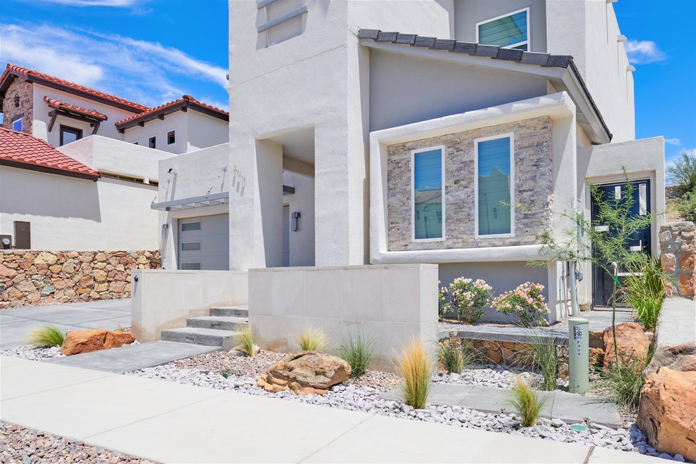 Inspiration for a small drought-tolerant front yard concrete paver garden path.