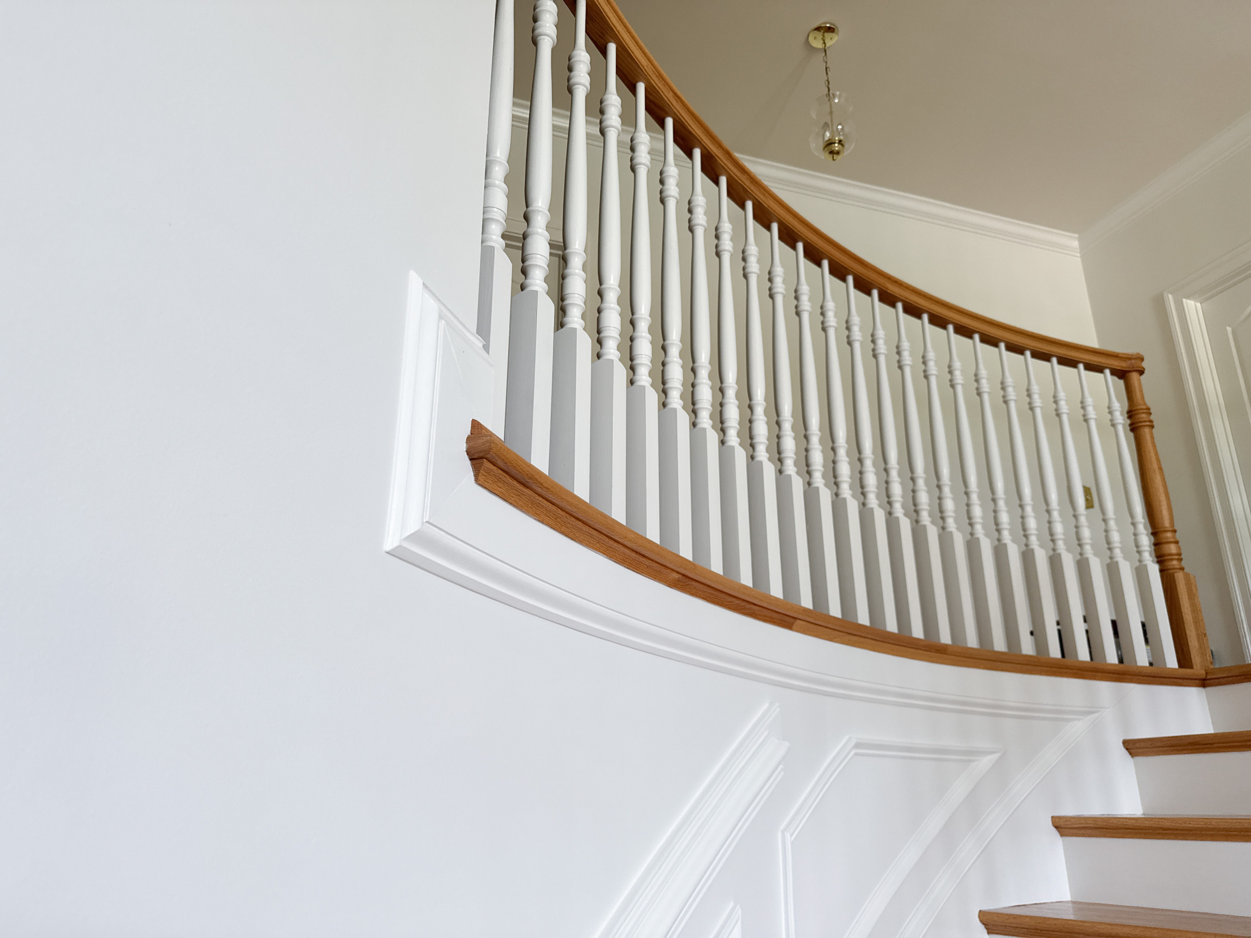 Project #161 | Curved Red Oak Foyer Staircase, 26 Years Later