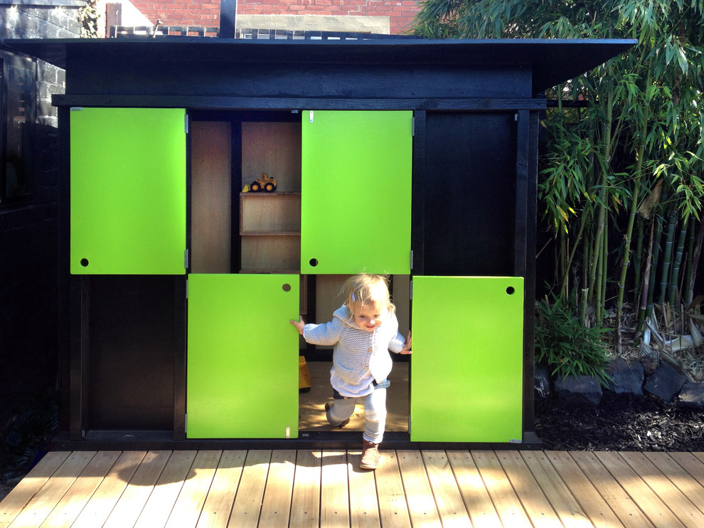 Inspiration for a small modern garden in Melbourne with with outdoor playset.