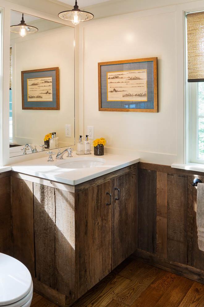 Example of a small mountain style 3/4 dark wood floor bathroom design in Boston with flat-panel cabinets, distressed cabinets, a two-piece toilet, white walls, an undermount sink and quartz countertops