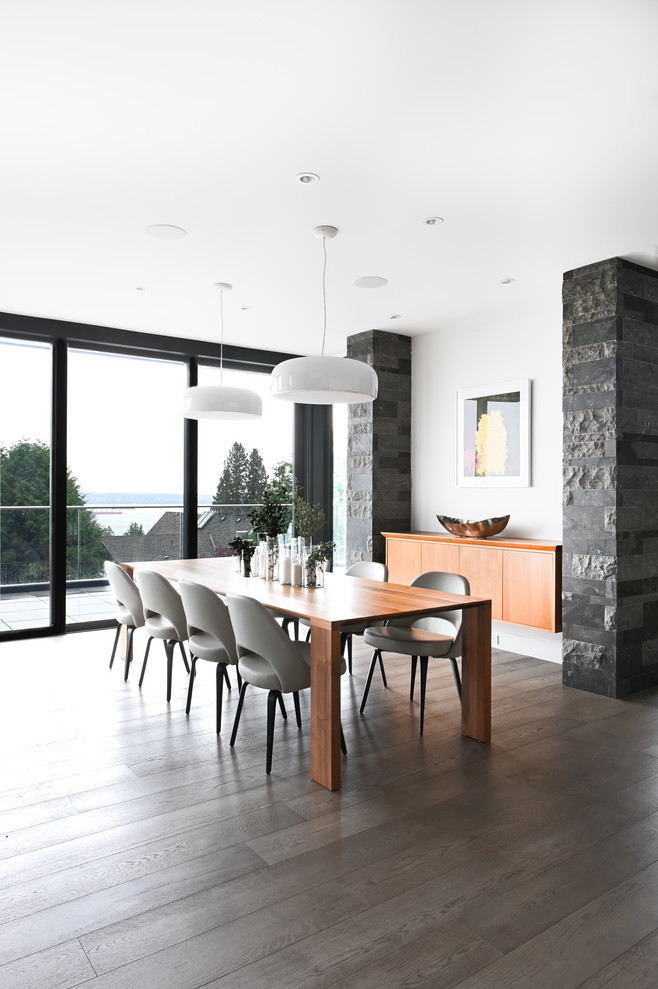 This is an example of a large contemporary dining room in Vancouver with white walls.