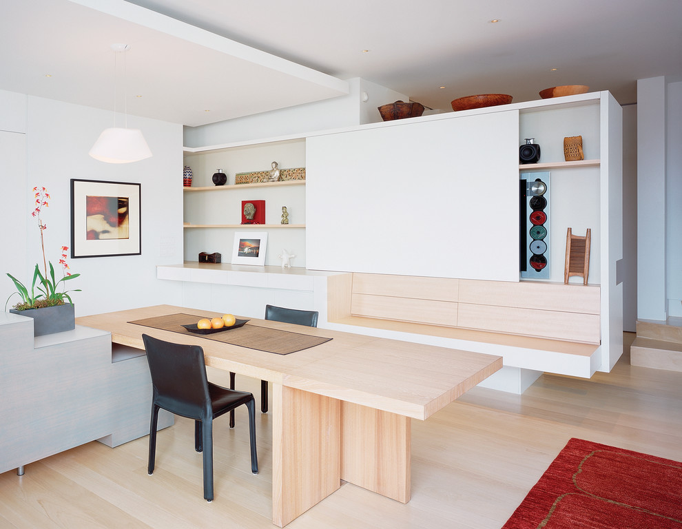 Modern dining room in San Francisco with white walls.