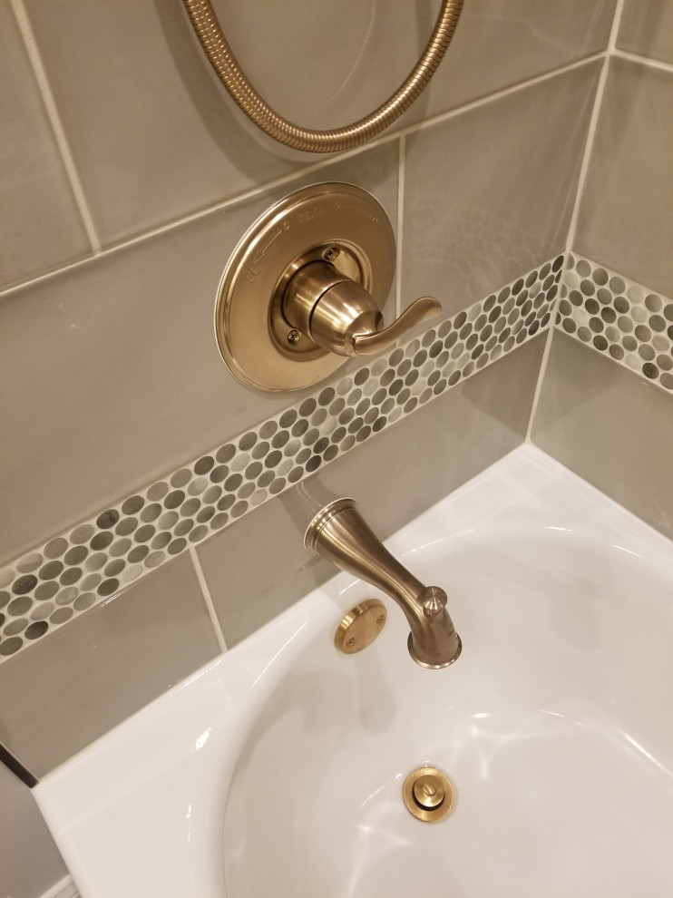 Inspiration for a transitional kids' gray tile and ceramic tile porcelain tile alcove bathtub remodel with gray walls