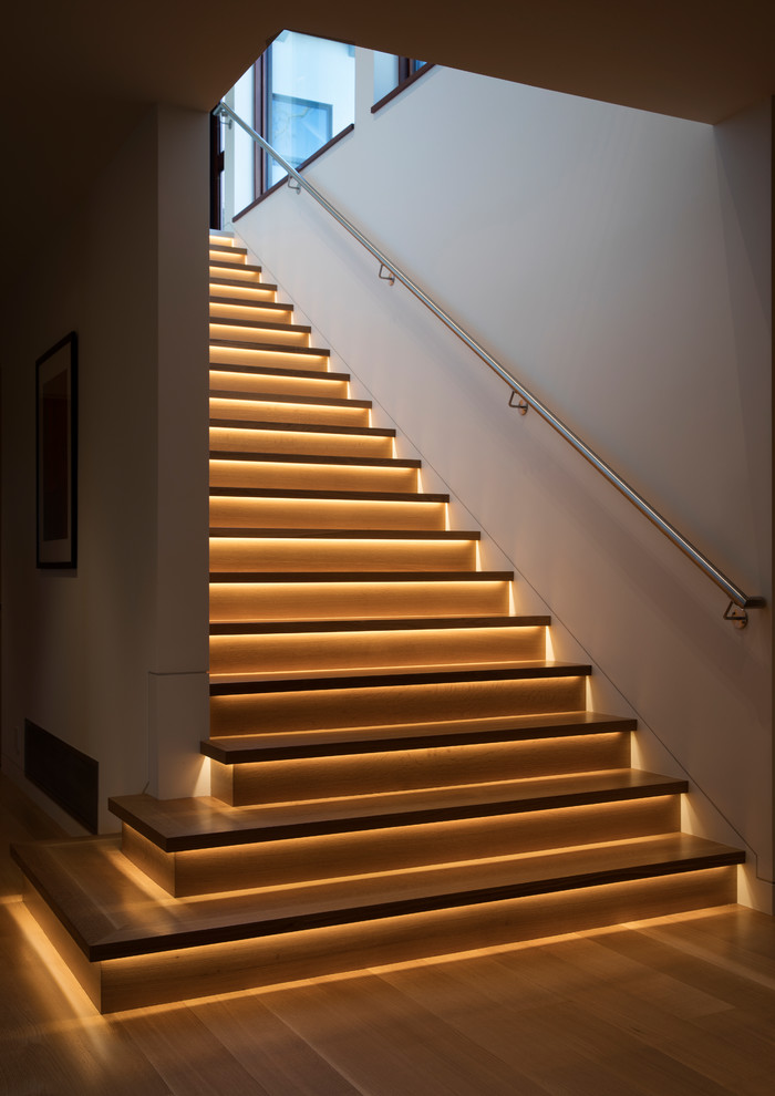 Photo of a mid-sized contemporary wood straight staircase in San Francisco with wood risers and metal railing.
