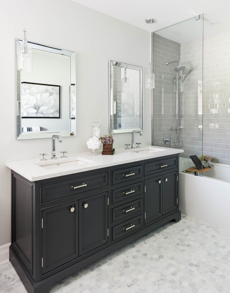 Mid-sized transitional master bathroom in Toronto with an undermount sink, recessed-panel cabinets, quartzite benchtops, an alcove tub, a shower/bathtub combo, gray tile, subway tile, grey walls, marble floors, black cabinets and grey floor.
