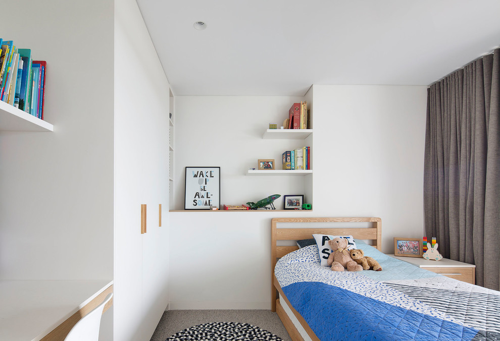 Design ideas for a mid-sized modern kids' bedroom for kids 4-10 years old and boys in Sydney with white walls, carpet and grey floor.