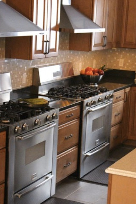 Open concept kitchen - large transitional porcelain tile open concept kitchen idea in DC Metro with a farmhouse sink, raised-panel cabinets, medium tone wood cabinets, quartz countertops, beige backsplash, mosaic tile backsplash, stainless steel appliances and an island