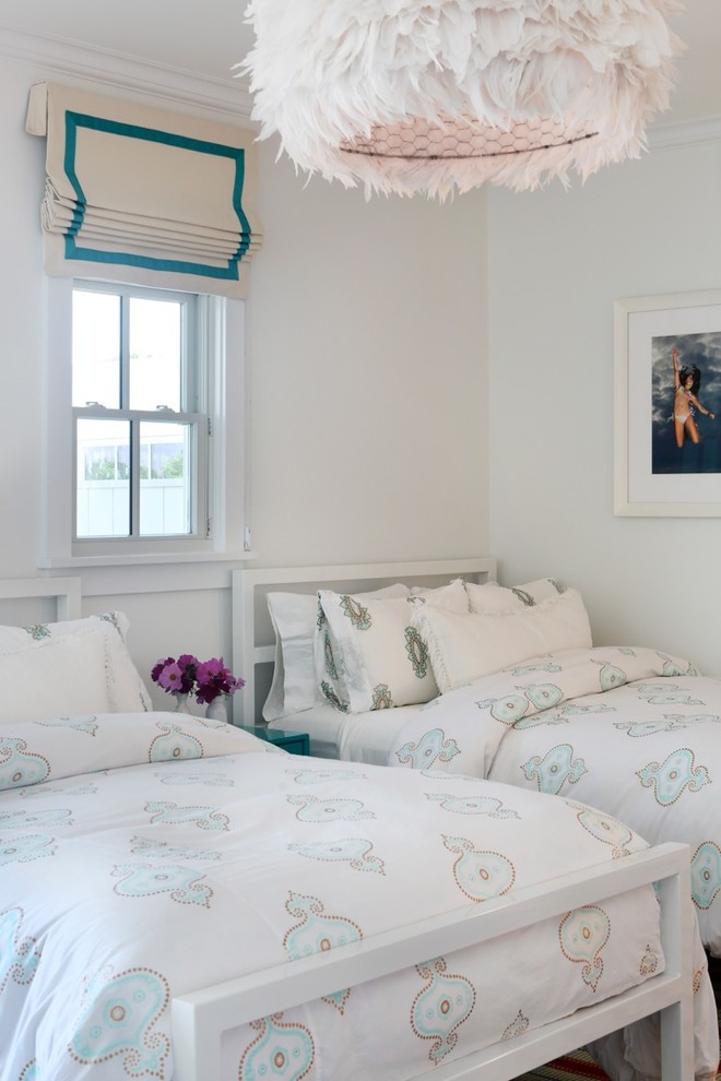 This is an example of a mid-sized traditional kids' bedroom for kids 4-10 years old and girls in New York with white walls.