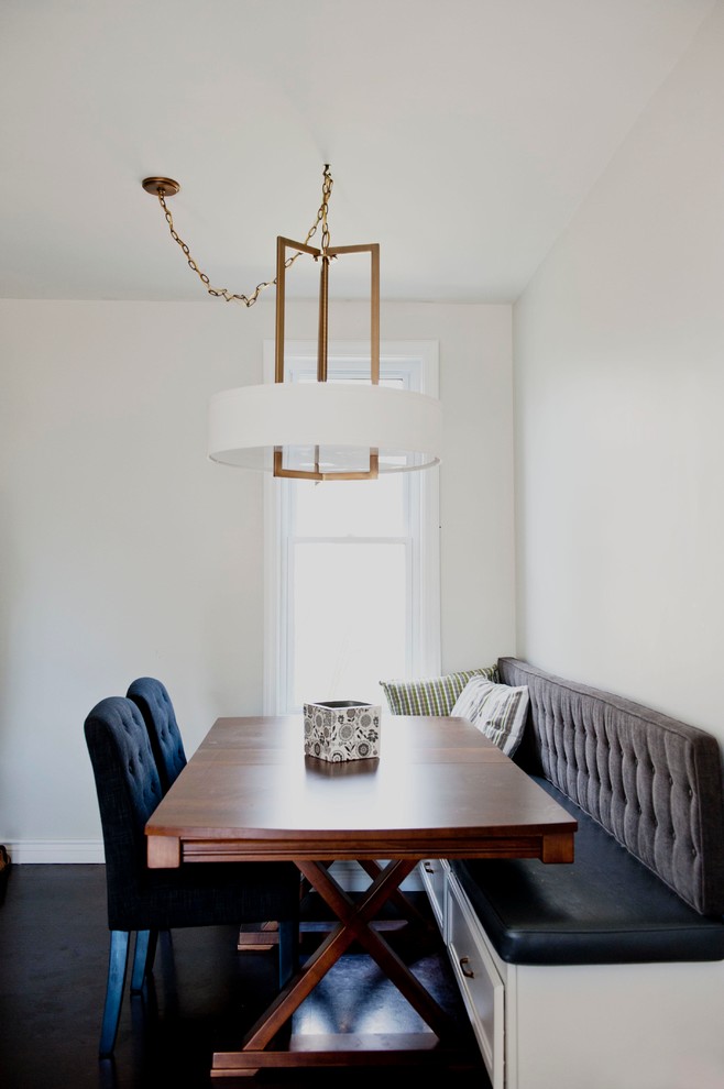 Design ideas for a transitional dining room in Calgary with white walls.