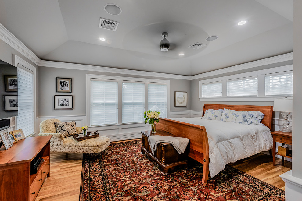 Design ideas for a large transitional guest bedroom in Boston with grey walls, dark hardwood floors and brown floor.