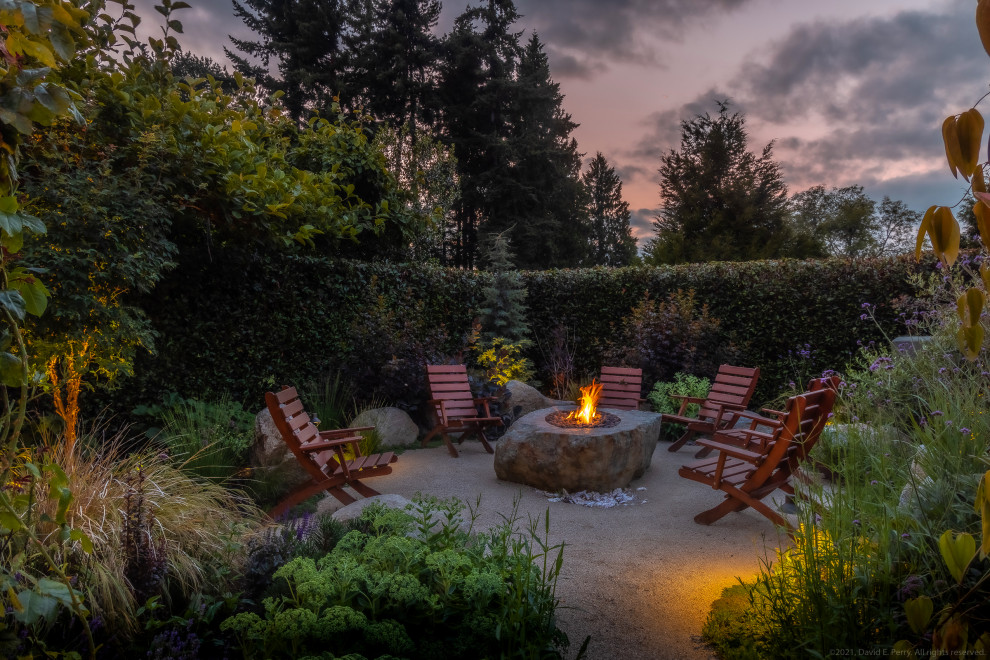 Inspiration for a mediterranean patio remodel in Seattle with a fire pit and no cover