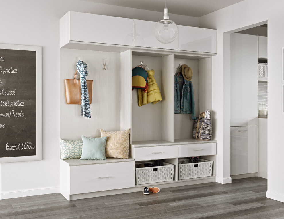 Photo of a mid-sized transitional mudroom in Los Angeles with white walls, porcelain floors and grey floor.