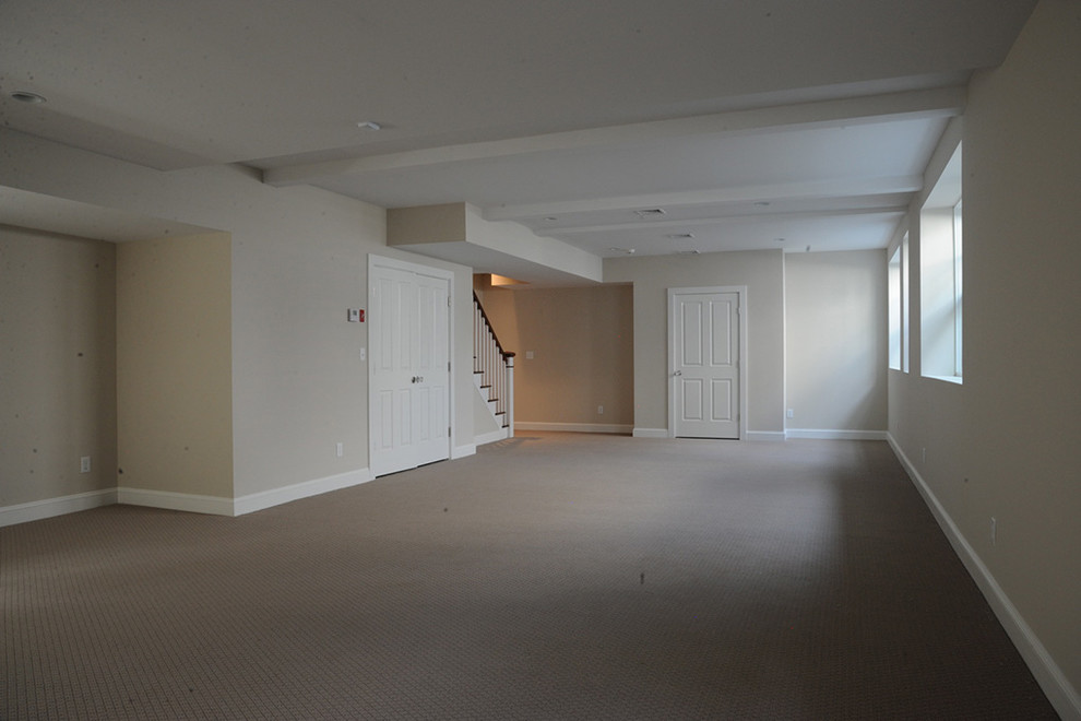 Inspiration for a large transitional carpeted and beige floor basement remodel with beige walls