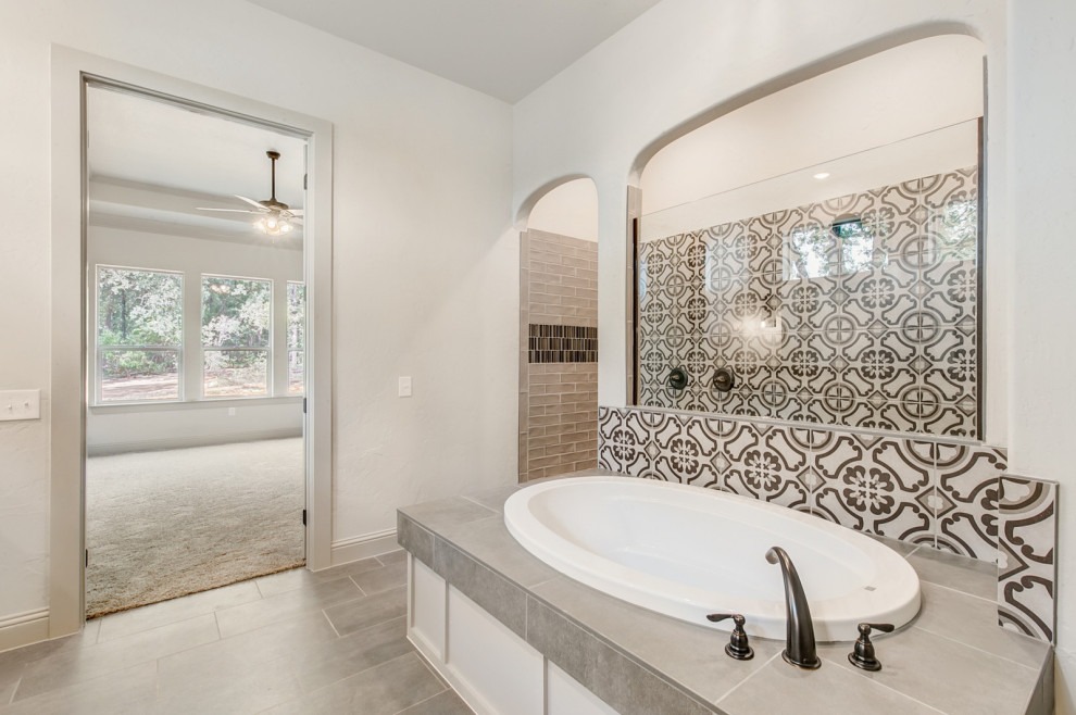 Design ideas for a transitional master wet room bathroom in Dallas with flat-panel cabinets, white cabinets, a drop-in tub, black and white tile, ceramic tile, white walls, an undermount sink, marble benchtops, grey floor, an open shower, a two-piece toilet, porcelain floors and multi-coloured benchtops.