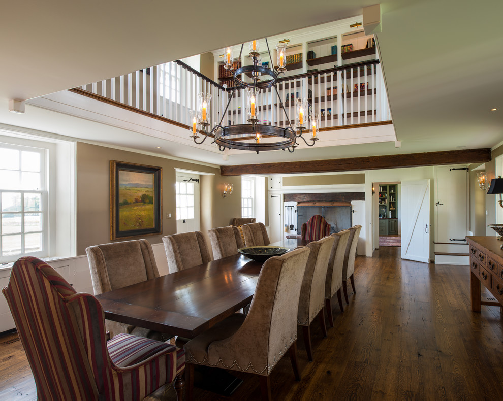 This is an example of an expansive country dining room in Philadelphia with beige walls and dark hardwood flooring.