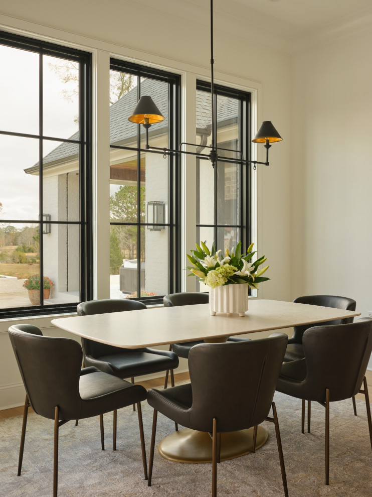 Dining room - transitional medium tone wood floor and brown floor dining room idea with white walls