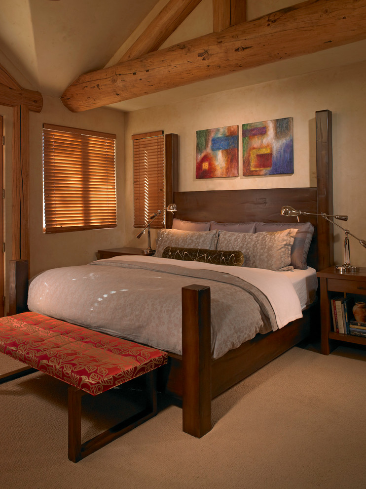 Mid-sized country master bedroom in Austin with beige walls, carpet, no fireplace and beige floor.