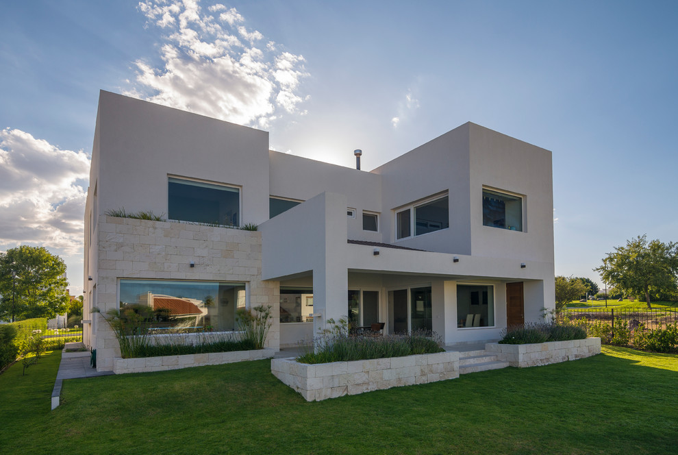 Contemporary two-storey white exterior in Other.