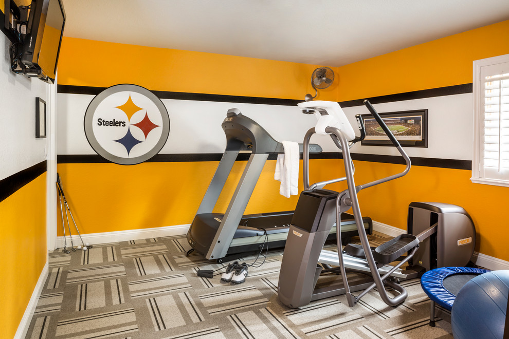 Mid-sized traditional multipurpose gym in Las Vegas with yellow walls and carpet.