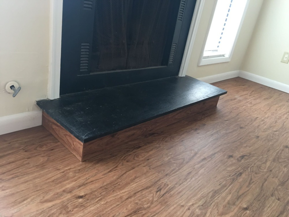 We put the flooring around the fireplace base....Turned out nice.