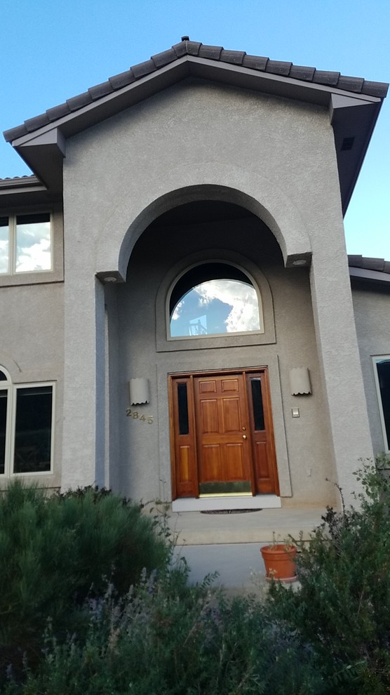Mid-sized single front door photo with a brown front door