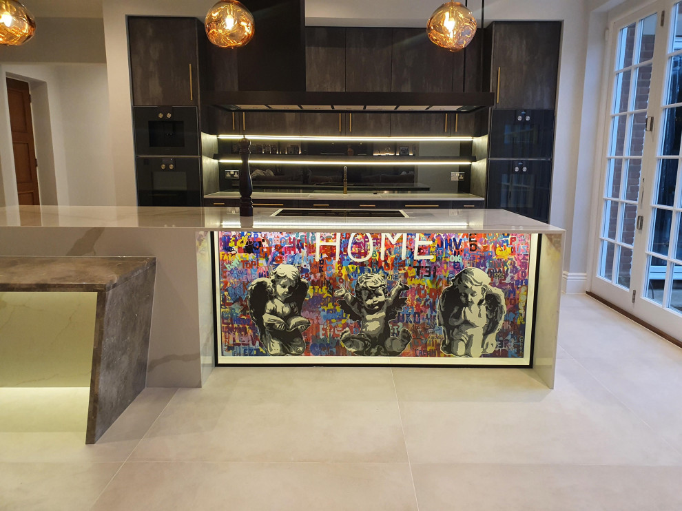 This is an example of a large contemporary single-wall eat-in kitchen in London with a drop-in sink, flat-panel cabinets, grey cabinets, solid surface benchtops, grey splashback, mirror splashback, black appliances, ceramic floors, with island, white floor and multi-coloured benchtop.
