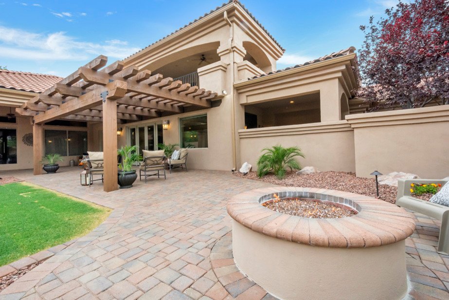 Patio - large transitional backyard concrete paver patio idea in Phoenix with a fire pit and a pergola